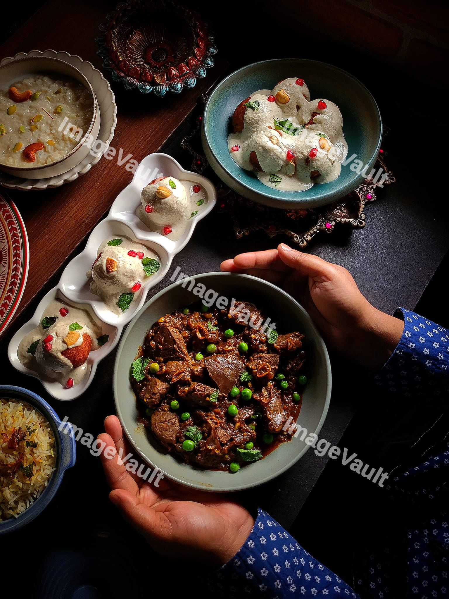 A person holding a bowl with beef stew